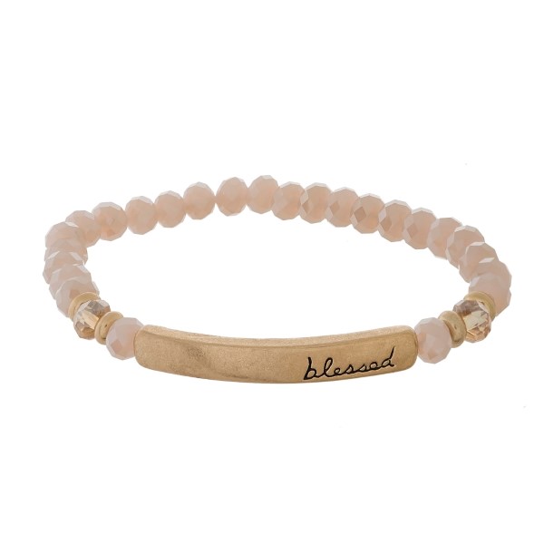 Beaded stretch bracelet with a bar focal, stamped with "blessed."