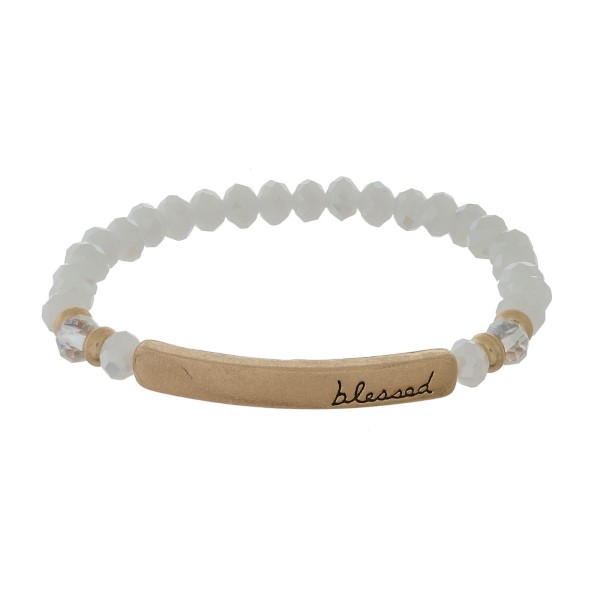 Beaded stretch bracelet with a bar focal, stamped with "blessed."