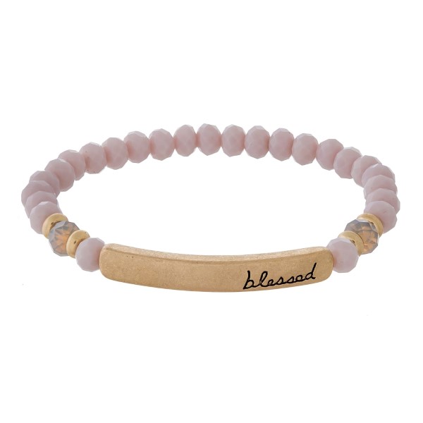 Beaded stretch bracelet with a bar focal, stamped with "blessed."