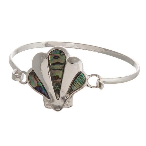 Metal, latch bracelet with a sea life focal. 