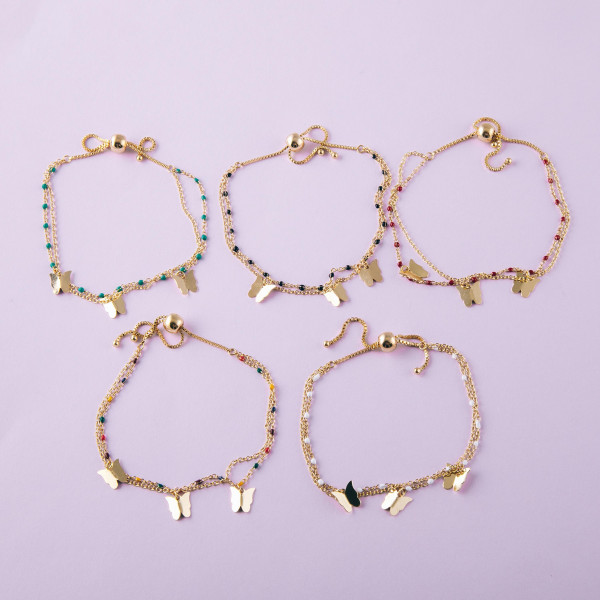 Dainty layered butterfly bolo bracelet. Approximately 3" in diameter. Fits up to a 6" wrist with adjustable bolo closure.