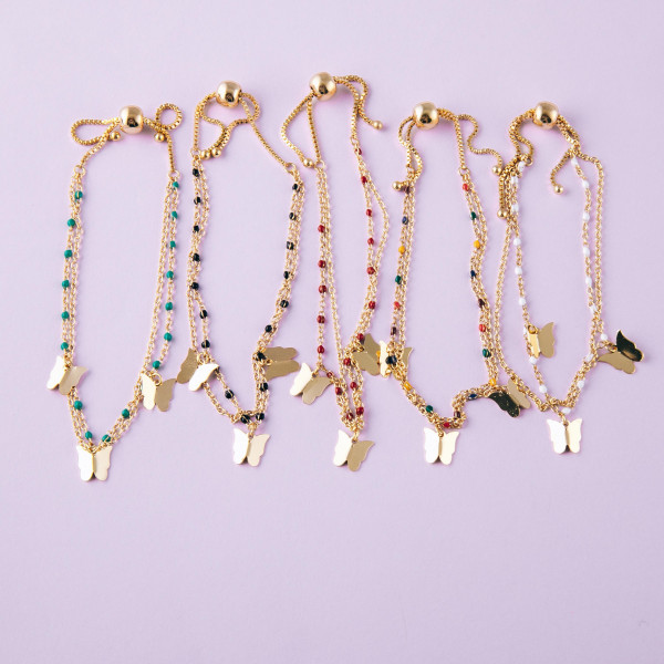 Dainty layered butterfly bolo bracelet. Approximately 3" in diameter. Fits up to a 6" wrist with adjustable bolo closure.