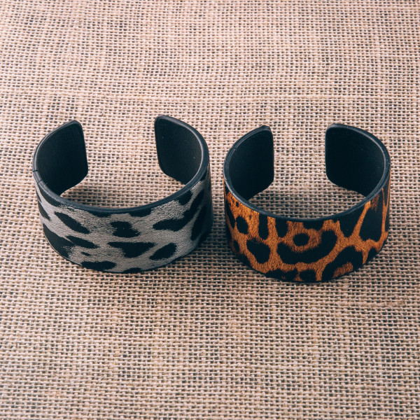 Faux leather leopard print cuff bracelet. Approximately 2.75" in diameter. Fits up to a 5.5" wrist.