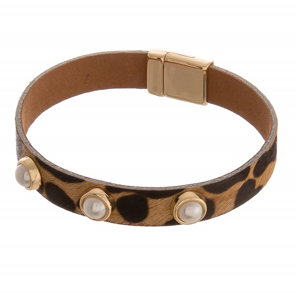 Cowhide leopard print pearl stud magnetic bracelet.

- Magnetic closure
- Approximately 3" in diameter 
- Fits up to a 6" wrist