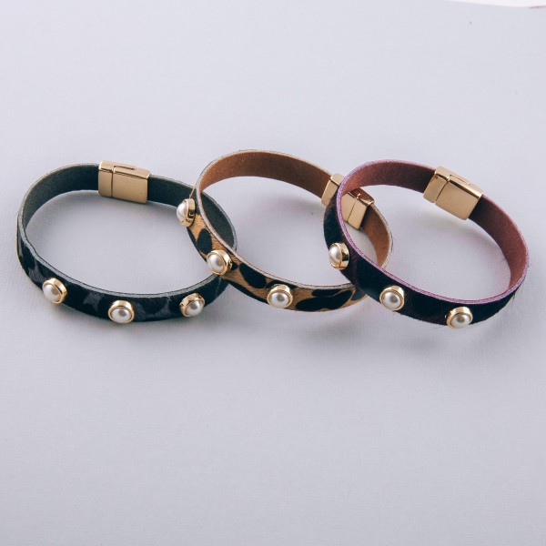 Cowhide leopard print pearl stud magnetic bracelet.

- Magnetic closure
- Approximately 3" in diameter 
- Fits up to a 6" wrist