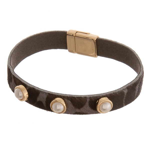 Cowhide leopard print pearl stud magnetic bracelet.

- Magnetic closure
- Approximately 3" in diameter 
- Fits up to a 6" wrist