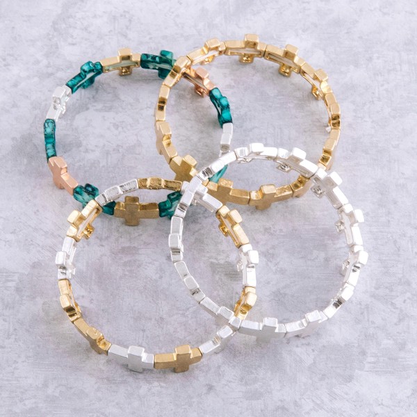 Metal cross stretch bracelet.

- Approximately 3" in diameter unstretched
- Fits up to a 7" wrist