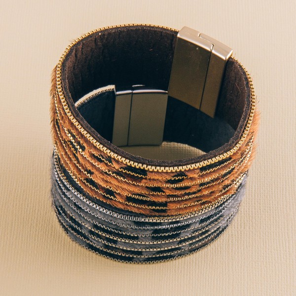 Leopard print cowhide metal striped magnetic bracelet.

- Faux leather
- Magnetic closure
- Approximately 3" in diameter
- Fits up to a 6" wrist