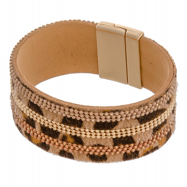 Faux leather leopard print cowhide magnetic bracelet with beaded accents.

- Approximately 3" in diameter 
- Fits up to a 6" wrist