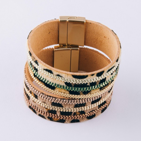 Faux leather leopard print cowhide magnetic bracelet with beaded accents.

- Approximately 3" in diameter 
- Fits up to a 6" wrist