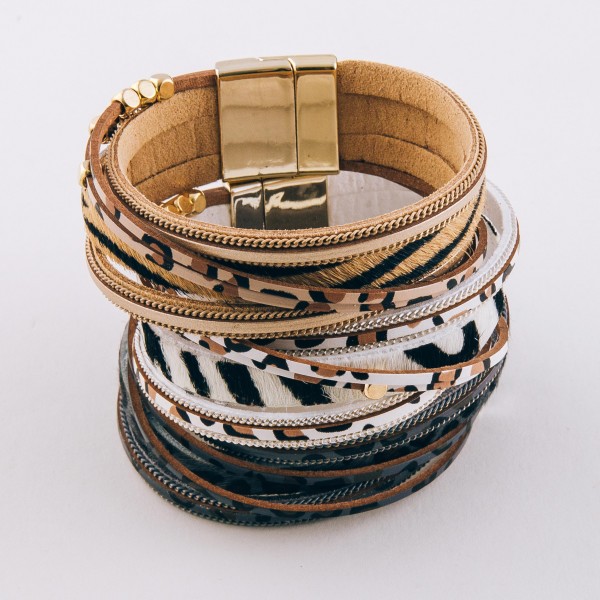 Faux leather multi strand animal print magnetic bracelet with gold bead accents.

- Magnetic closure
- Approximately 3" in diameter
- Fits up to a 6" wrist