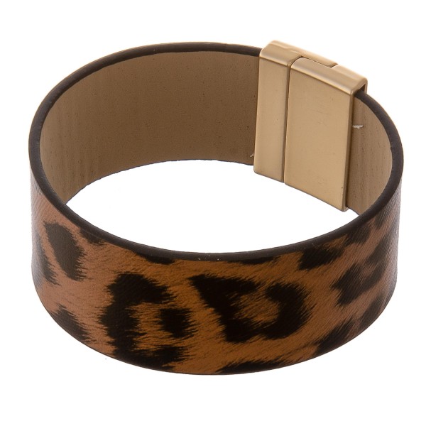 Faux leather leopard print magnetic bracelet.

- Magnetic closure
- Approximately 3" in diameter
- Fits up to a 6" wrist
- Approximately 1" wide