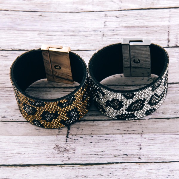 Faux leather rhinestone leopard print turn lock bracelet.

- Turn Lock closure
- Approximately 3" in diameter
- Fits up to a 6" wrist
- Approximately 1.5" wide