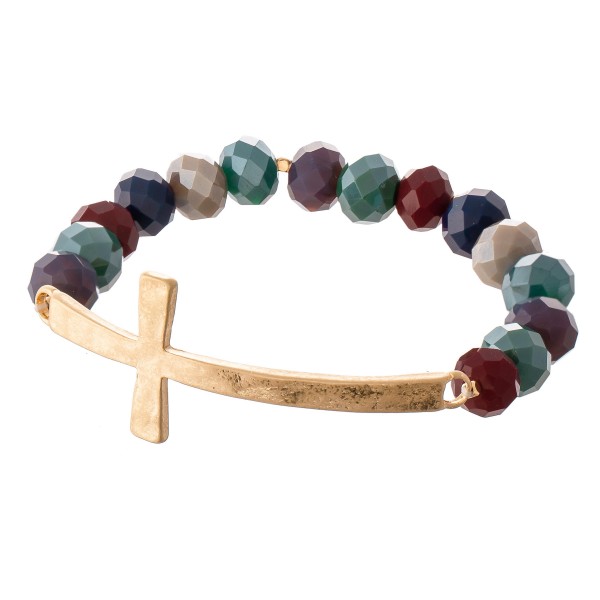 Facet Beaded Stretch Bracelet Featuring an East West Cross Focal. 

- Approximately 3" Diameter 