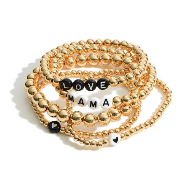 Set of Five Gold Beaded Bracelets Featuring Letter Beads that Say