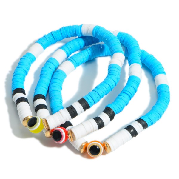 Set of Three Heishi Bead Bracelets Featuring Evil Eye Accents. 

- Approximately 3" in Diameter 