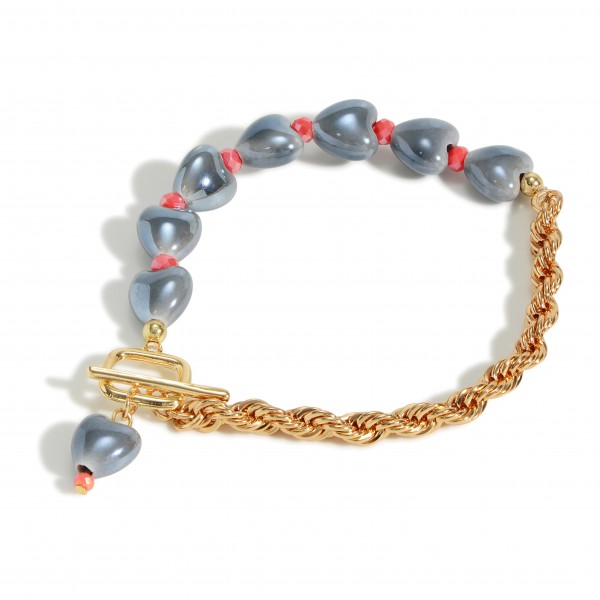 Gold Tone Rope Chain Link Bracelet Featuring Ceramic Heart Beads

- Approximately 3" Diameter