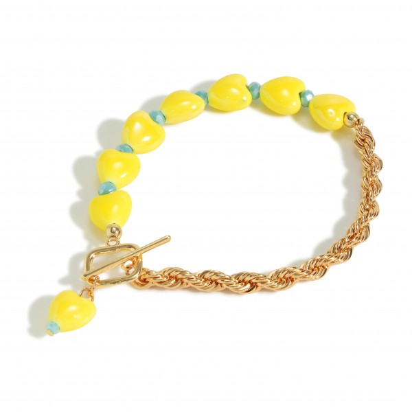 Gold Tone Rope Chain Link Bracelet Featuring Ceramic Heart Beads

- Approximately 3" Diameter