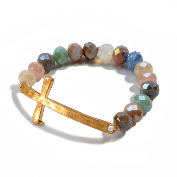 Facet Beaded Stretch Bracelet Featuring an East West Cross Focal. 

- Approximately 3" Diameter 