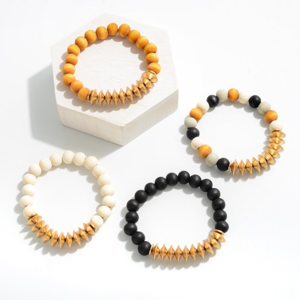 Brown Wooden Stretch Bracelet With Gold Metal Bead Accents 

-Approximately 3" Diameter 