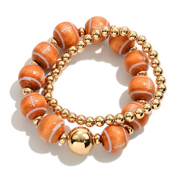 Set of Two Beaded Stretch Bracelets Featuring Wood Football and Gold Tone Beads.

- Approximately 2.5" - 3" D