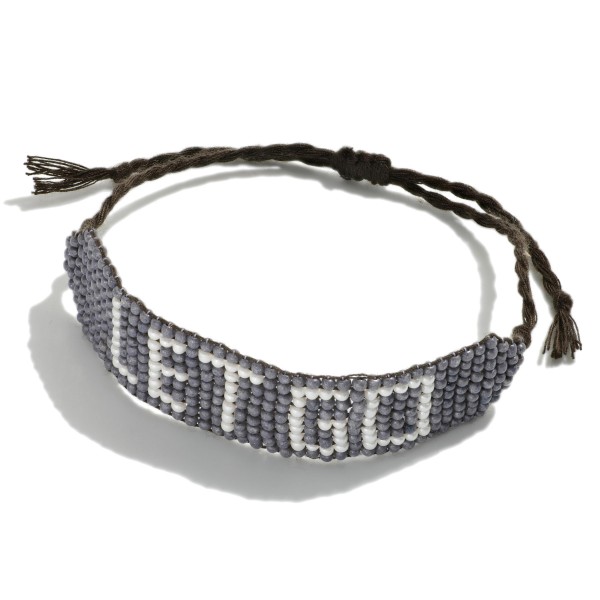 Adjustable "Let Go" Seed Bead Woven Cord Bracelet.

- Approximately 2 - 4" Diameter

