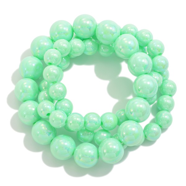 Set of Three Pearlescent Beaded Stretch Bracelets With Graduating Bead Size

- Approximately 2.5" D