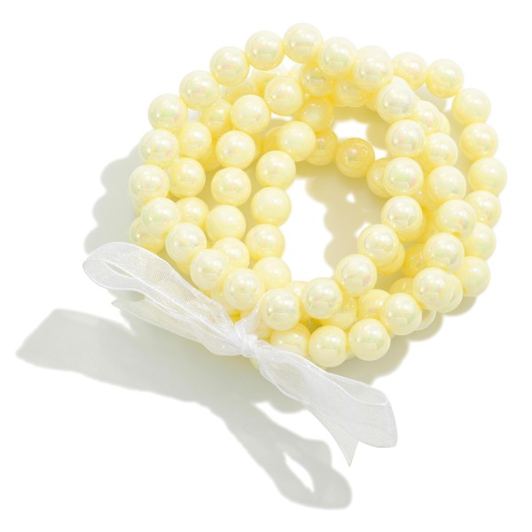 Set of Five Pearlescent Beaded Stretch Bracelet Set With Tied Bow Detail

- Approximately 2.5" D