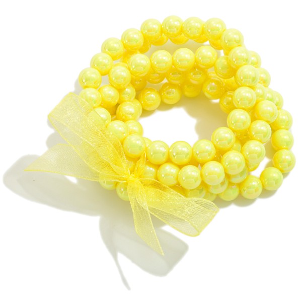 Set of Five Pearlescent Beaded Stretch Bracelet Set With Tied Bow Detail

- Approximately 2.5" D