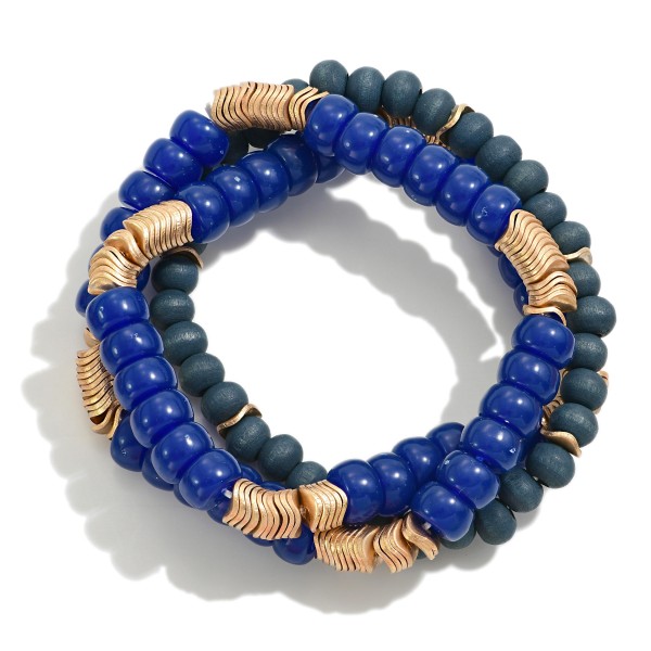 Set of Three Beaded Stretch Bracelets Featuring Wood, Acetate, and Wavy Gold Tone Disk Beads

- Approximately 2.5" D