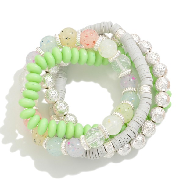 Set of Four Beaded Stretch Bracelets Featuring Heishi Beads, Confetti Foil Beads, and Rounded Pastel Beads

- Approximately 2.5" D