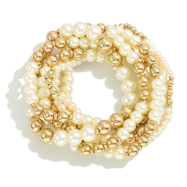 Set of Seven Tapered Pearl Beaded Stretch Bracelets 

- Approximately 2.5" D