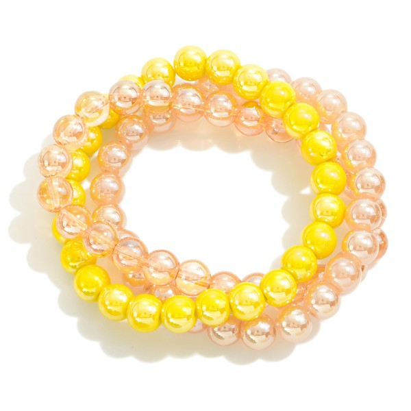 Set of Three Pearlescent Beaded Stretch Bracelets 

- Approximately 2.5" D 