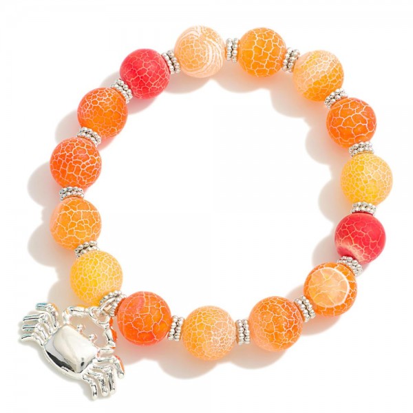 Beaded Stretch Bracelet With Crackled Detail Featuring Crab Pendant 

- Approximately 2.5" D