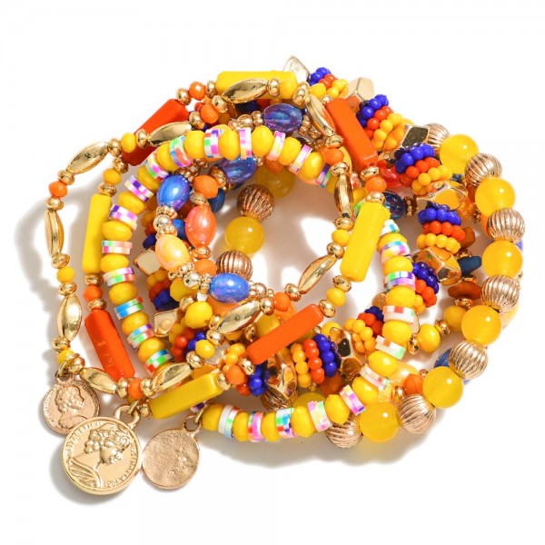 Set of Eight Beaded Stretch Bracelets Featuring Gold Accents & Textured Beads With Coin Charms

- Approximately 3.5" D