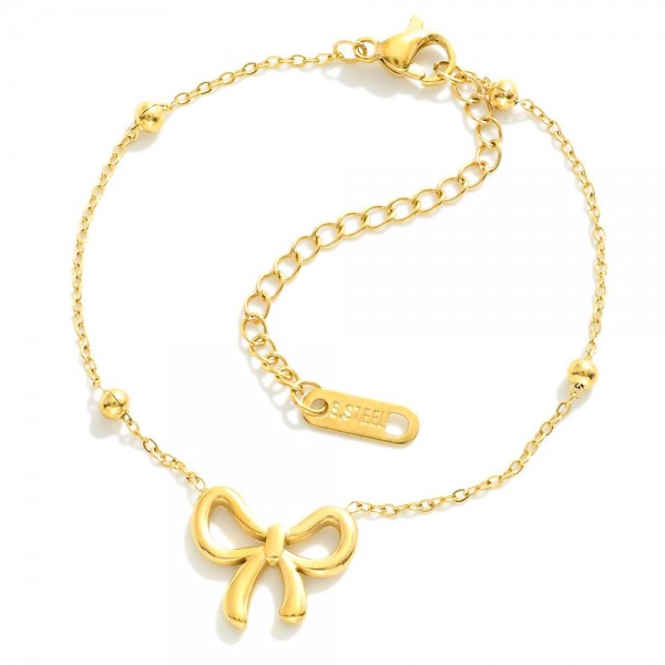 Metal Tone Saturn Chain Link Bracelet Featuring Bow Station

- Approximately 3." D
- Extender 2" L