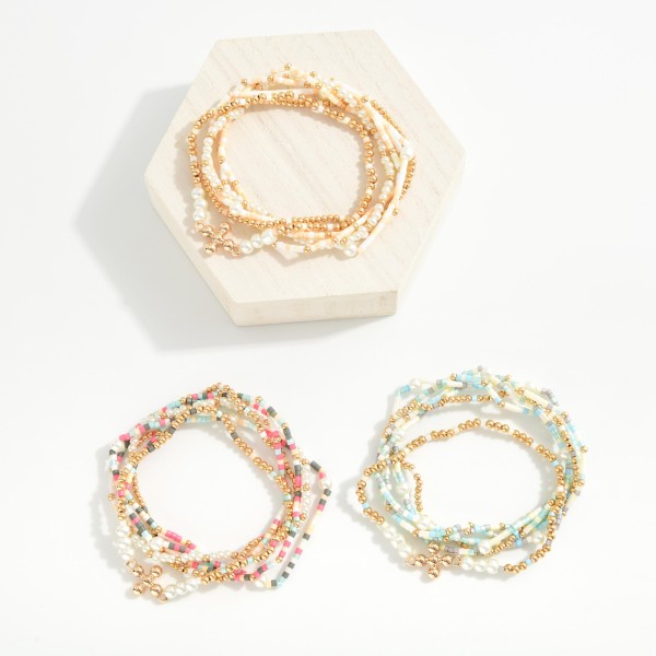 Set of Six Beaded Stretch Bracelets Featuring Pearl Beads and Dainty Cross Charm
- Approximately 2.5" D