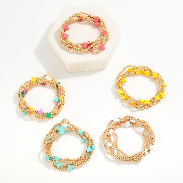 Set of Five Gold Tone Beaded Stretch Bracelets Featuring Criss Cross Bead Stations
- Approximately 2.5" D