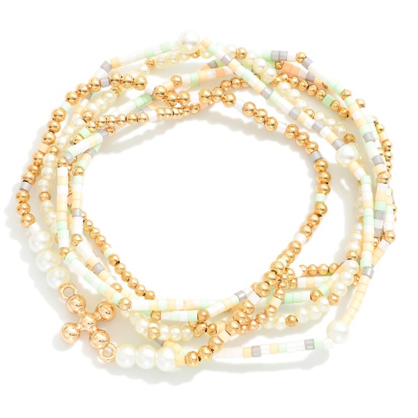 Set of Six Seed Bead and Metal Tone Bead Stretch Bracelets Featuring Dainty Metal Tone Beaded Cross Charm
- Approximately 2.5" D