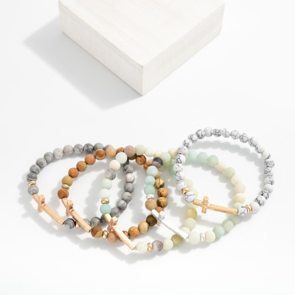 Stone Beaded Stretch Bracelet Featuring Hammered Metal Cross Station
- Approximately 2.5" D