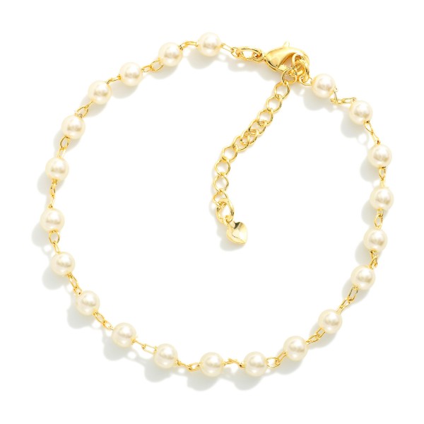 Chain Link Bracelet Featuring Pearls  

- Approximately 7" L
- Extender 2" L
- 18k Gold Filled
- Hypoallergenic
- Made In Brazil
