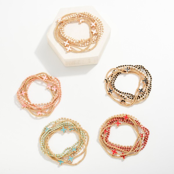 Set Of Seven Beaded Stretch Bracelets Featuring Metal Tones, Pearls, & Enamel Criss Cross Beads 
- Approximately 2.5" D