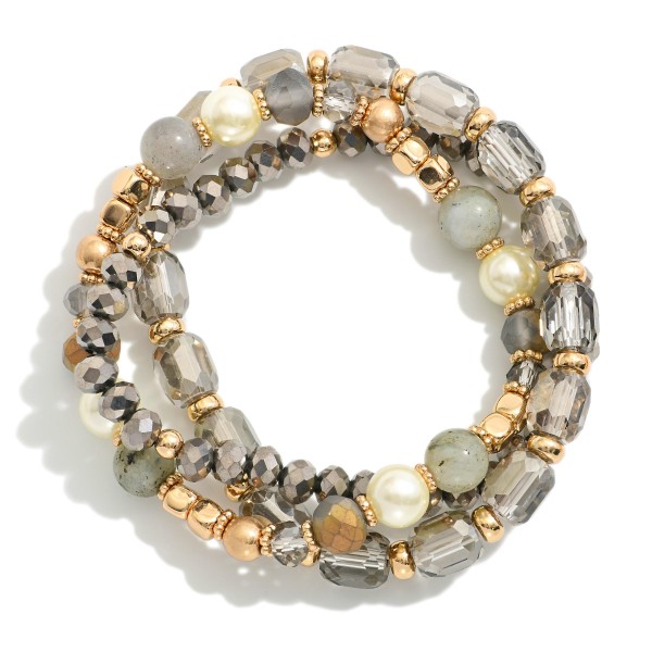 Set Of Three Beaded Stretch Bracelets Featuring Metal Tones, Pearls, & Iridescent Beads

- Approximately 2.5" D

