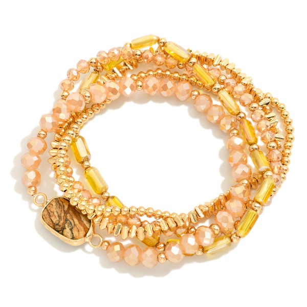 Set Of Five Beaded Stretch Bracelets Featuring Metal Tones, Faceted Beads, & Glass Crystal Accent

- Approximately 2.5" D

