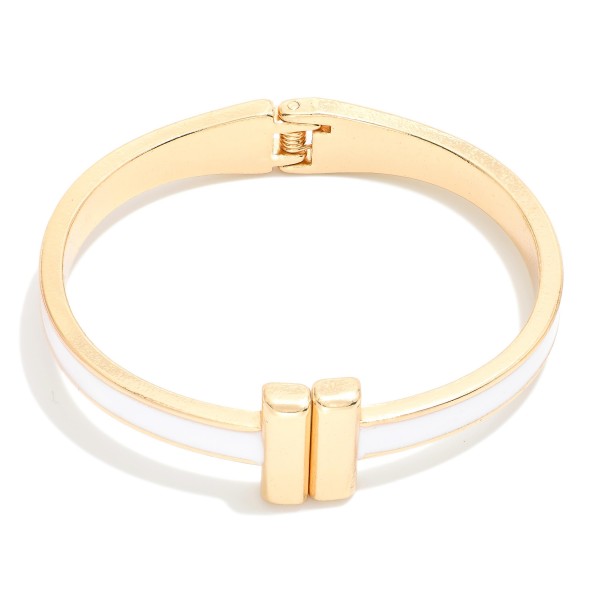 Metal Hinged Bangle Bracelet With Gold Tone Bar Closure 

- Approximately 2.25" D