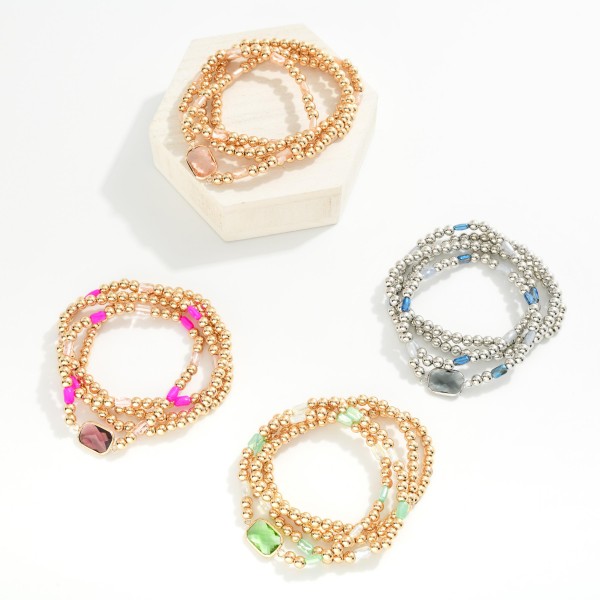 Set Of Four Metal Tone Beaded Stretch Bracelets Featuring Faceted Beads & Glass Crystal 

- Approximately 2.5" D