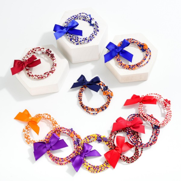 Set of Five Game Day Beaded Stretch Bracelets Featuring Ribbon Bow Detail And Criss Cross Bead Stations

- Approximately 2.5"
