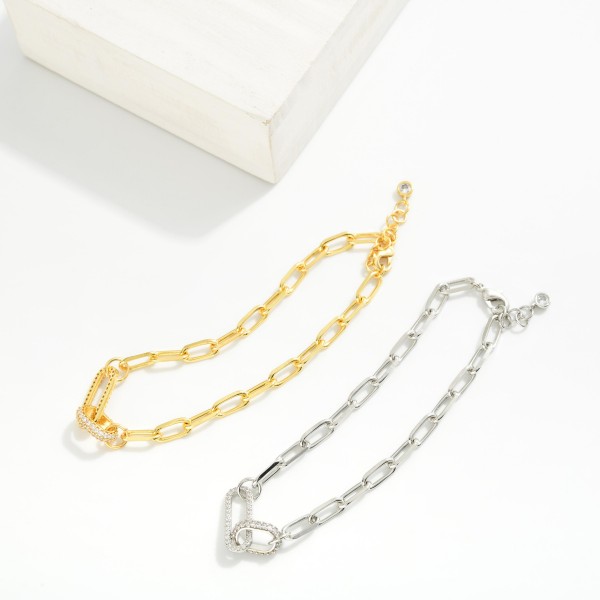 Paperclip Chain Link Bracelet Featuring Rhinestone Studded Links 

- Gold Dipped 
- Approximately 3" D
- Extender 1" L 