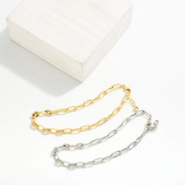 Paperclip Chain Link Bracelet Featuring Cubic Zirconia Details 

- Gold Dipped
- Approximately 3" D
- Extender 1" L
