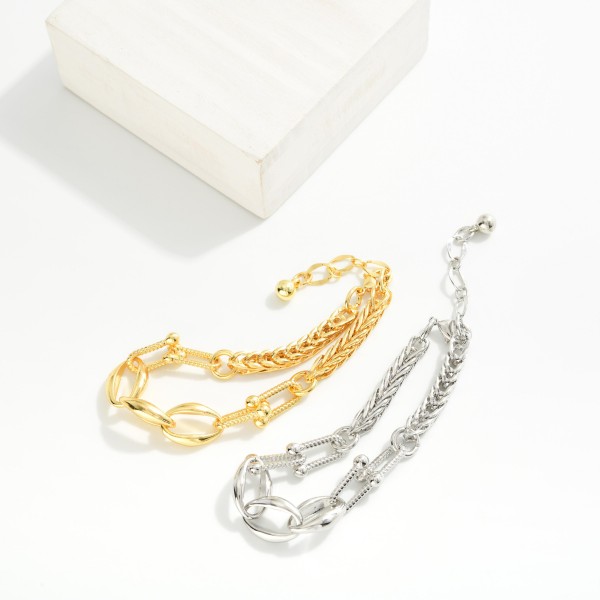 Spiga Chain Link Bracelet Featuring Oval & U Links 

- Gold Dipped 
- Approximately 3" D
- Extender 1" L
